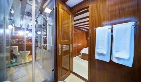 Stella Maris master cabin with king bed and adjoining ensuite visible