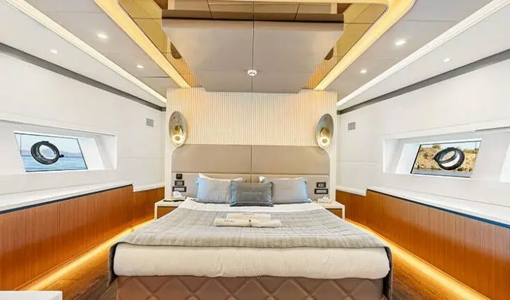 Master cabin with king bed and ensuite, soft lighting and wood accents