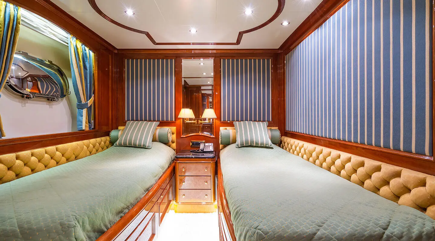 Amadea yacht exterior deck scene with lounge seating and polished wood finishes