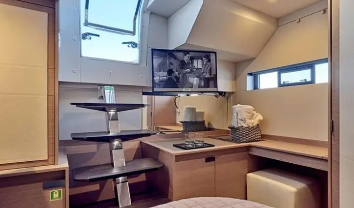 Interior of Christal Mio yacht cabin with seating area and window views