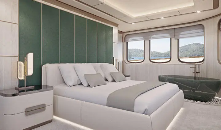 Maia yacht master cabin with king bed, plush white linens, and ensuite view