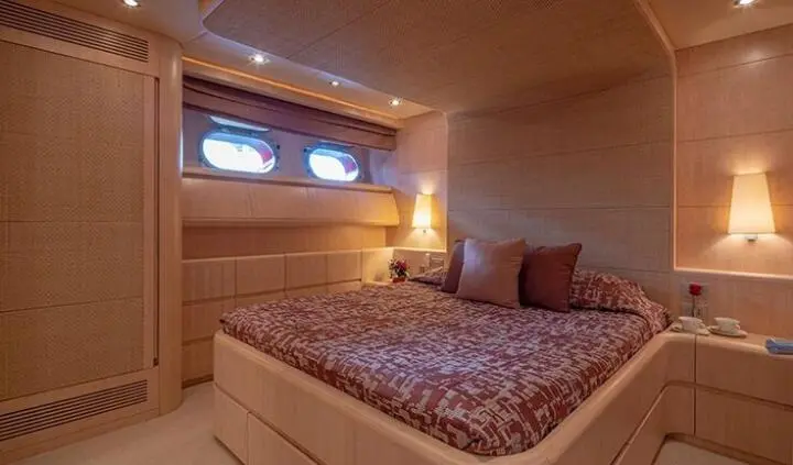 Glaros cabin with double bed, wood interior, porthole window, two pillows
