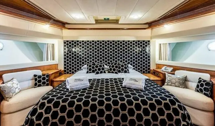Miss Katariina master cabin with king bed, en-suite visible in yacht interior