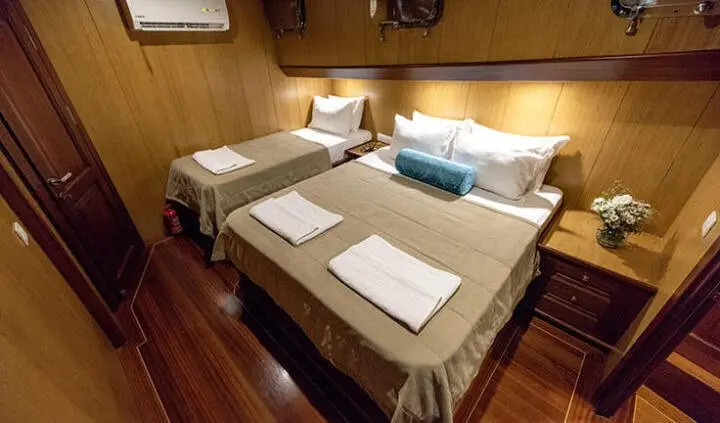 Kayhan 3 cabin twin bed yacht interior with two single beds and neutral linens