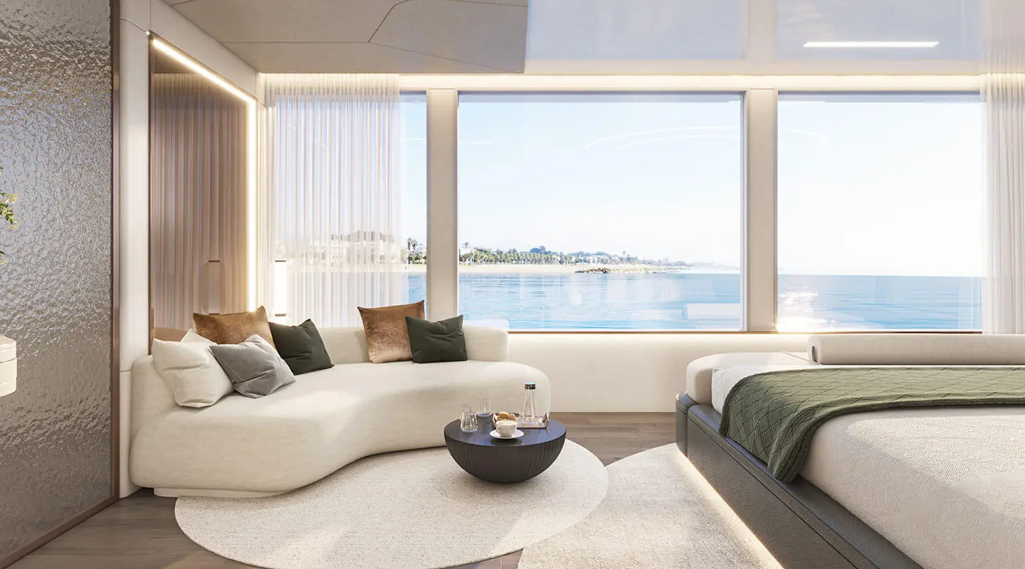 Interior view of a yacht living area with large windows overlooking the sea