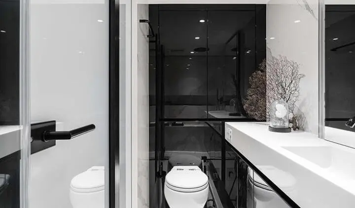 Cabin bed and ensuite aboard Above & Beyond yacht, compact restroom visible