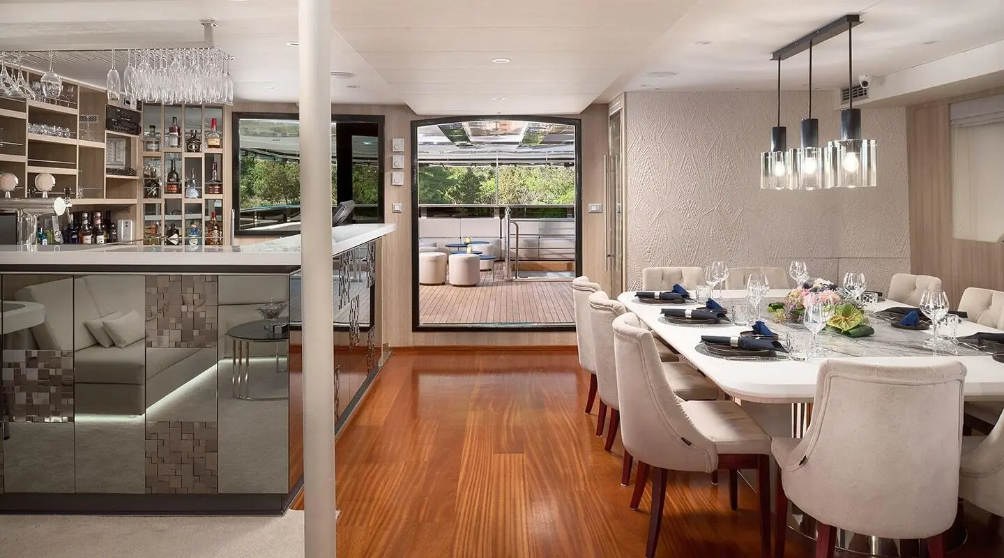Cristal yacht dining area aboard with large windows and wooden floor