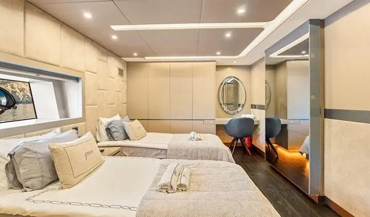 Master cabin with King bed, en-suite, neutral decor and seating area