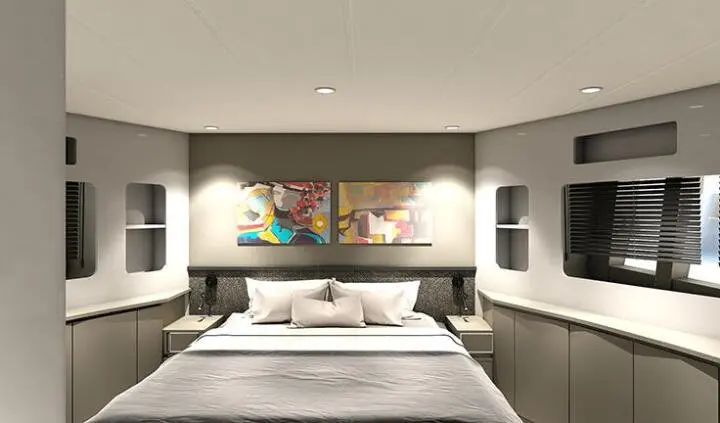Master cabin with king bed, white bedding, and ensuite entry on yacht