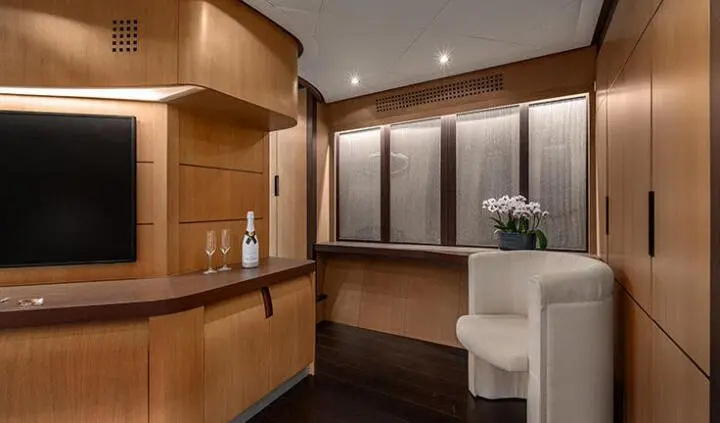 Master cabin with king bed, ensuite, wood accents and soft lighting