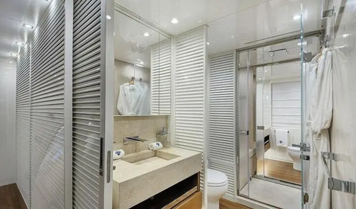 Morning Star cabin ensuite with vanity, mirror, and striped wall panels