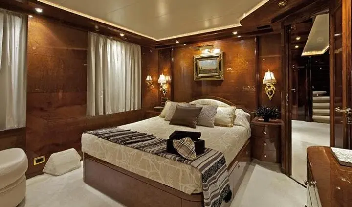 O'Rion master cabin with king bed, ensuite visible, warm wood panels