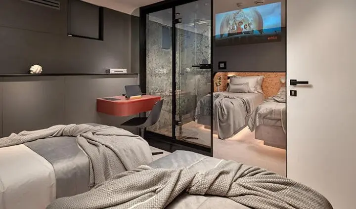 Shared cabin aboard Anetta yacht with two beds and ensuite area