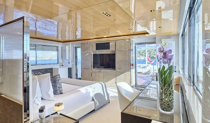Master cabin with king bed, ensuite, wood ceiling panels, modern decor