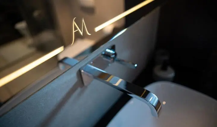 Anima Maris cabin interior with polished chrome faucet and sleek basin