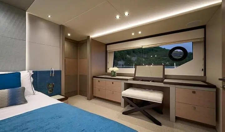 Master cabin with king bed, ensuite, wood tones, and built-in storage
