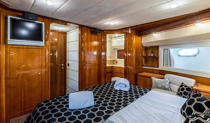 Miss Katariina master cabin with king bed and ensuite door, wood paneling
