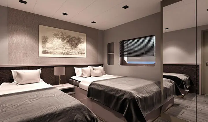 Twin-cabin yacht interior with two single beds, lamps, and window view