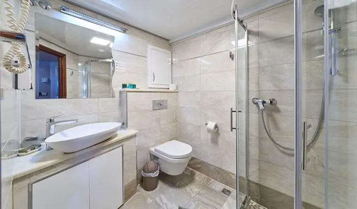 Casablanca yacht master cabin with king bed, ensuite shower, neutral tones