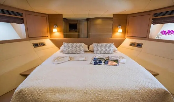 Salt cabin with two large beds, pillows, and warm bedside lamps