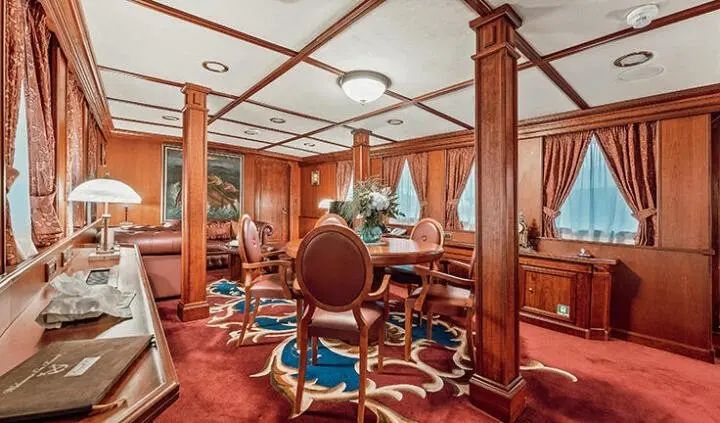 Seagull II cabin with king bed and ensuite visible in luxurious wood interior