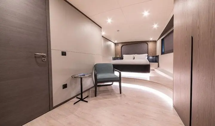 Interior cabin of Good Life yacht with double cabin bed and ensuite hint