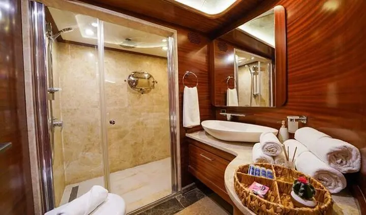 Bathroom en-suite cabin on La Bella Vita yacht, tiled shower area visible