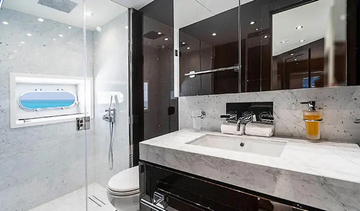 Quantum yacht cabin with king bed and ensuite bathroom, modern decor