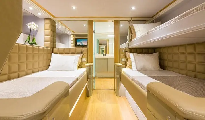 Twin cabin aboard Aquarella: two beds, ensuite area, wooden flooring