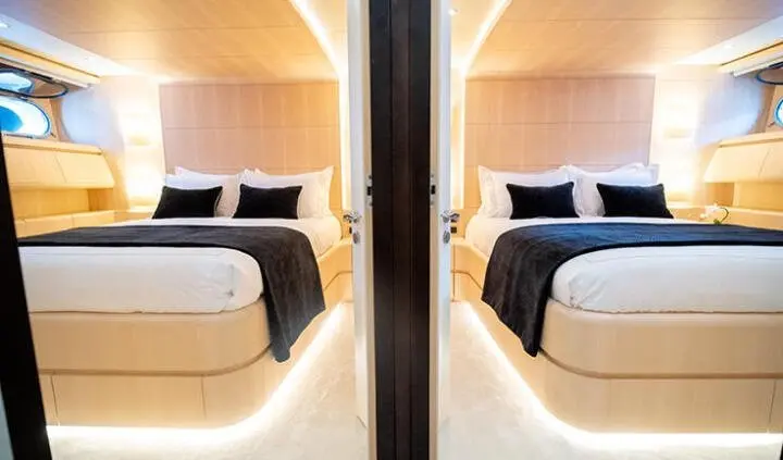 Pareaki II cabin ensuite bed scene with two twin beds and wooden accents