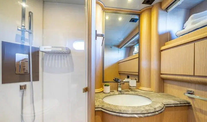 Phantom yacht cabin with king bed, ensuite vanity and mirrored wardrobe