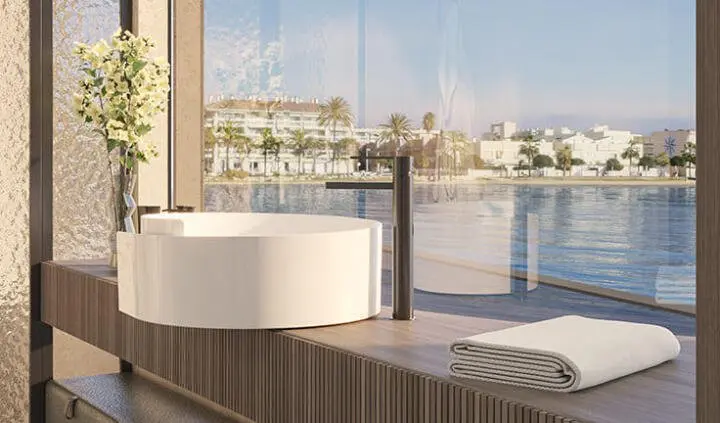 Master cabin king bed with ensuite on Bello yacht, waterfront view visible