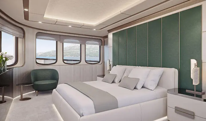 Maia yacht master cabin with king bed, white linens, and seating area