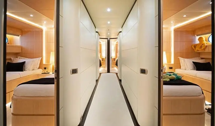 Pareaki II master cabin with a large king bed and ensuite bathroom visible