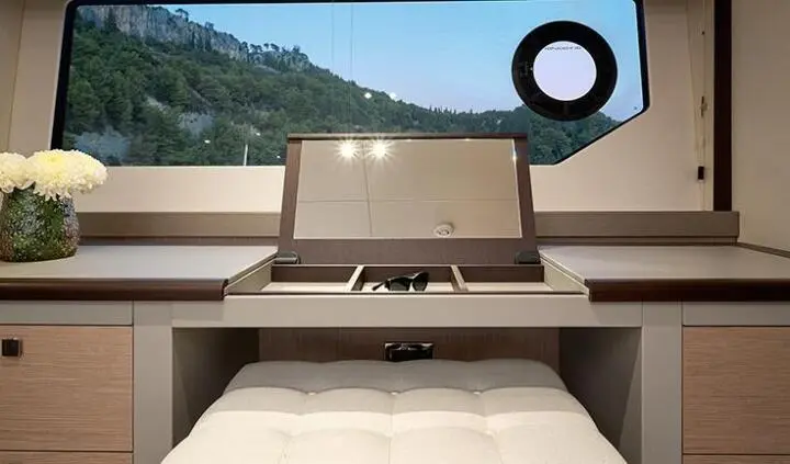 Master cabin with king bed and ensuite on Hideaway yacht, sunlit