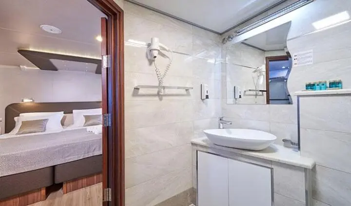 Casablanca yacht master cabin with king bed and ensuite bathroom visible