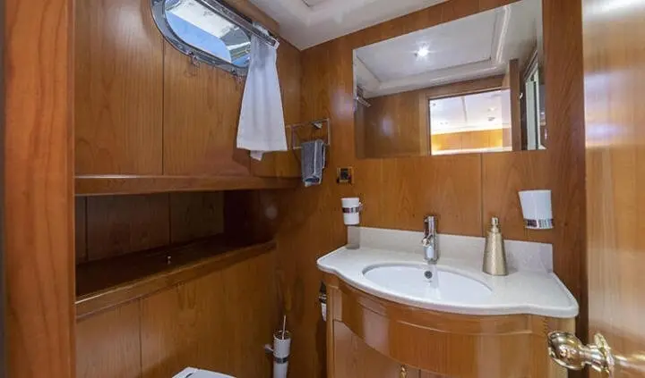 Queen Of Sea master cabin with king bed and ensuite bathroom, wood panelling