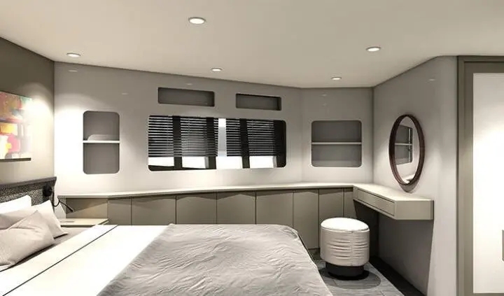 Master cabin with king bed, gray upholstery, windows, and a circular stool