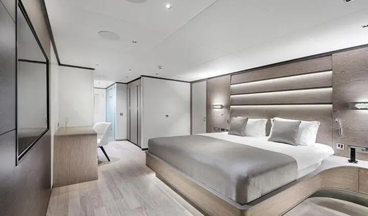 Luxurious master cabin with king bed, ensuite, and modern decor