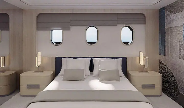 Maia yacht master cabin with king bed, neutral bedding and bedside lamps