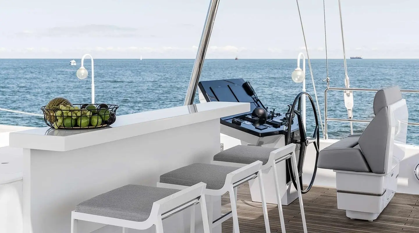 Gulet yacht Above & Beyond seen from aft deck with white seating and blue sea