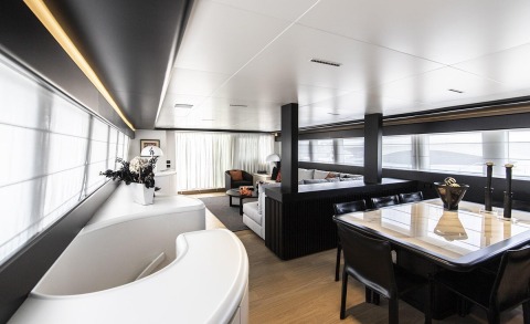 Spacious interior with white furniture, seating area, and dining table