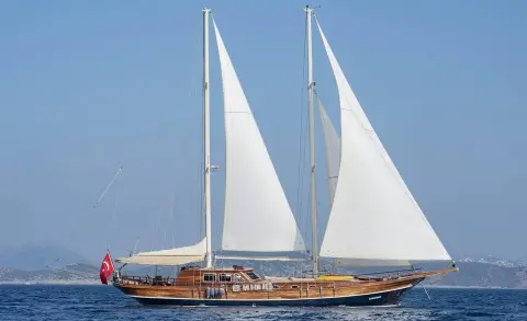 Samarkand luxury sailing yacht with tall masts and white sails on blue sea