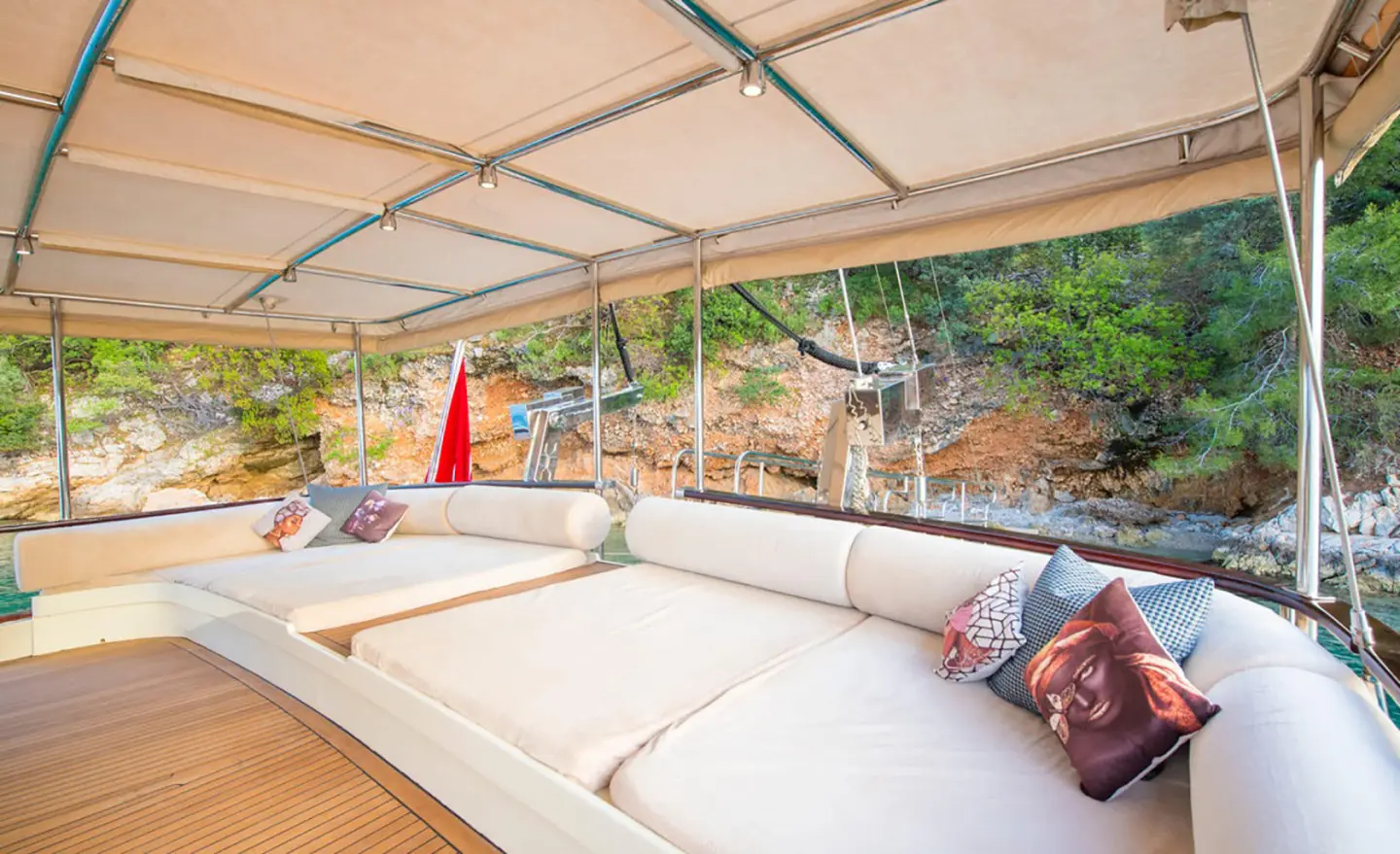 Luxurious yacht Mein Schatz deck seating under shade with cushions and reef view