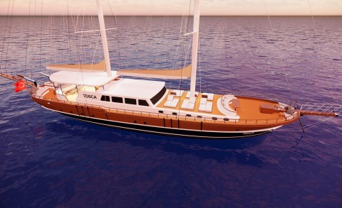 Tosca yacht at sea with a brown and white hull, central deck seating, and lounging area, Turkish flag at the stern