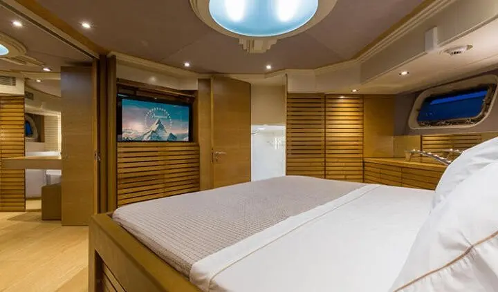 Yacht Aquarella master cabin with king bed, ensuite, wood paneling