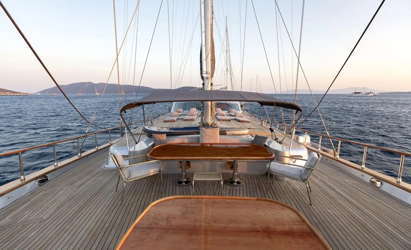 View from the bow on a gulet named Silver Moon, teak deck and sailing rig