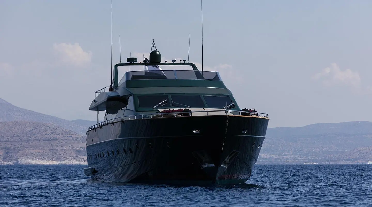 Large luxury yacht named Can't Remember anchored on calm blue sea