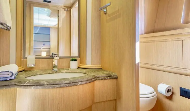 Phantom yacht cabin with king bed, wooden panels, ensuite area and window view