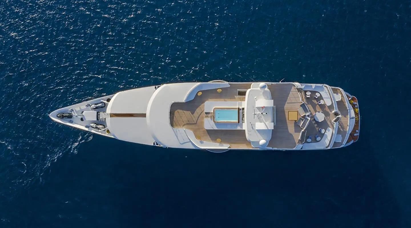 Aerial view of the luxury yacht Marquise, deck and swimming pool visible at sea